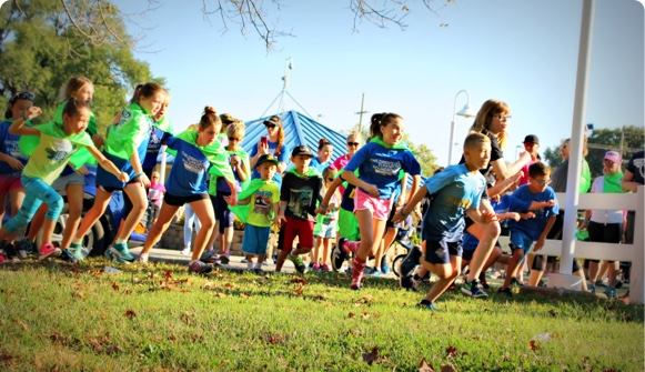 A group of children running in a race.