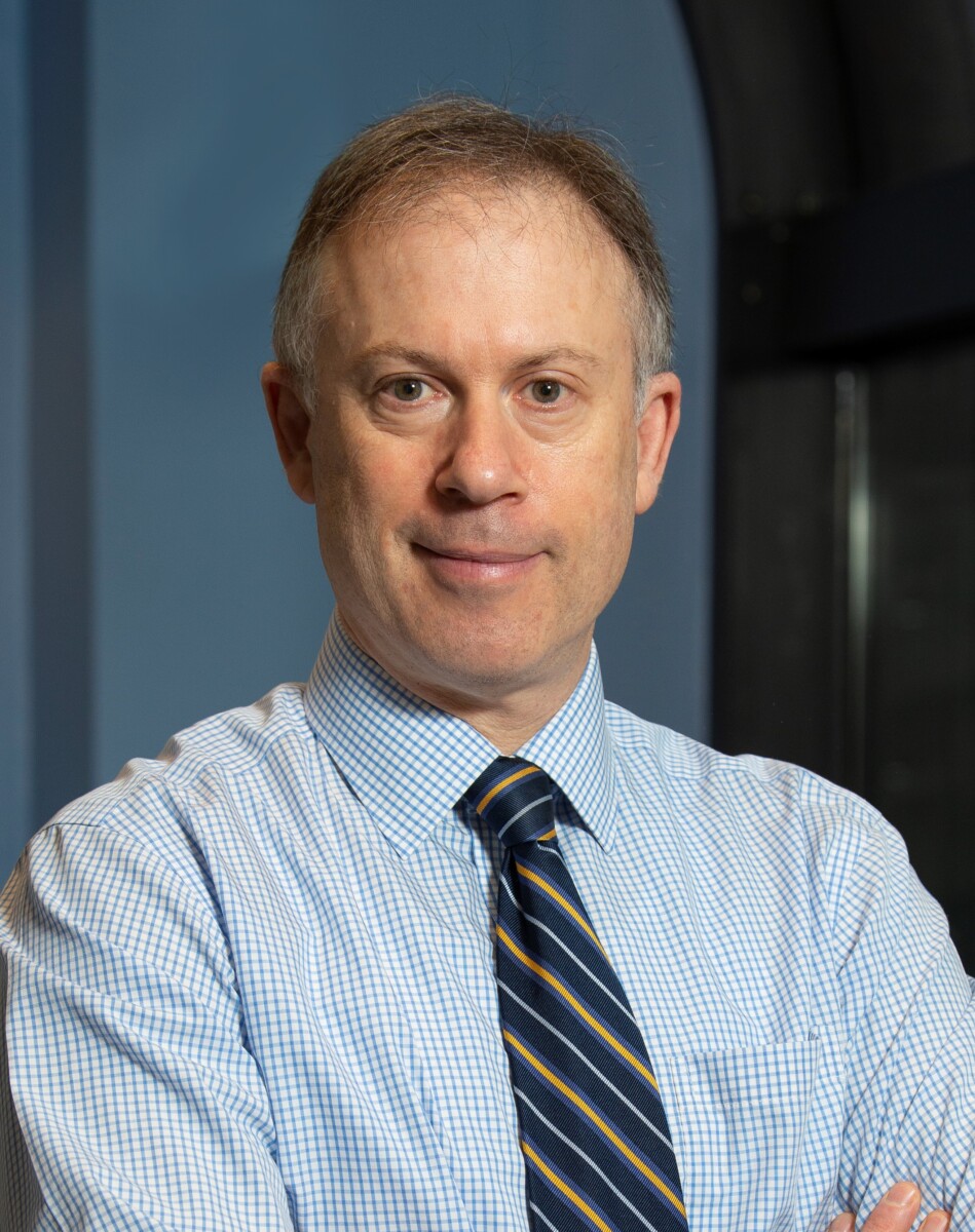 A man in a blue shirt and tie.