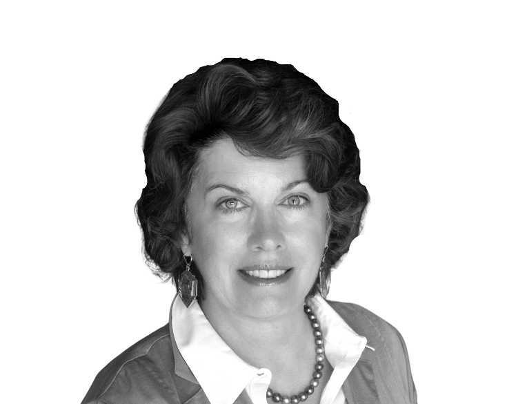 A black and white photo of a woman wearing a necklace.