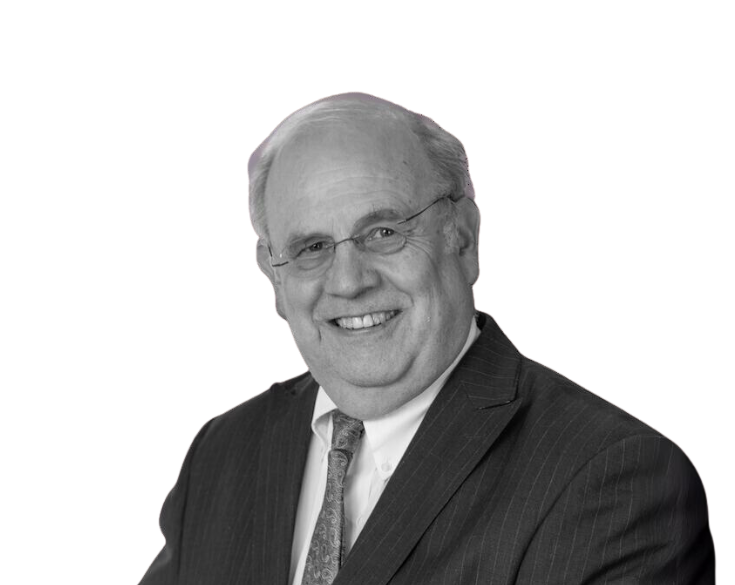 A black and white photo of a man in a suit and tie.