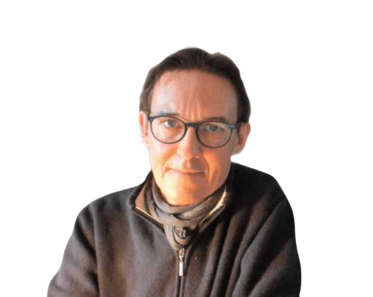 A man wearing glasses and a sweater.