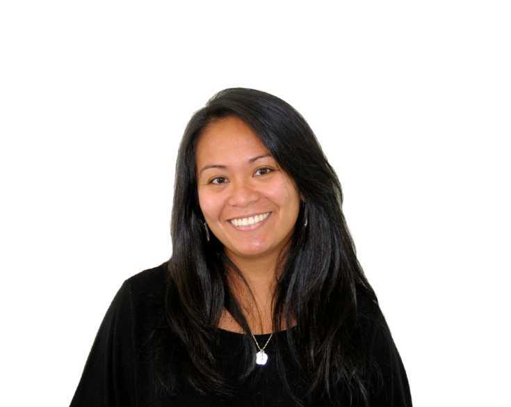 A woman in a black shirt smiling for the camera.