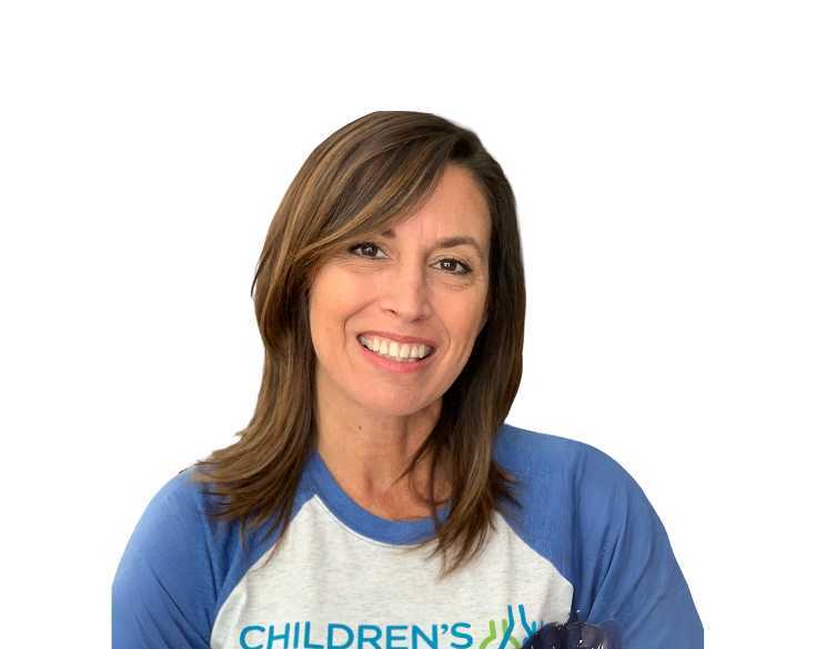 A woman wearing a blue and white t - shirt with the word children's aid on it.