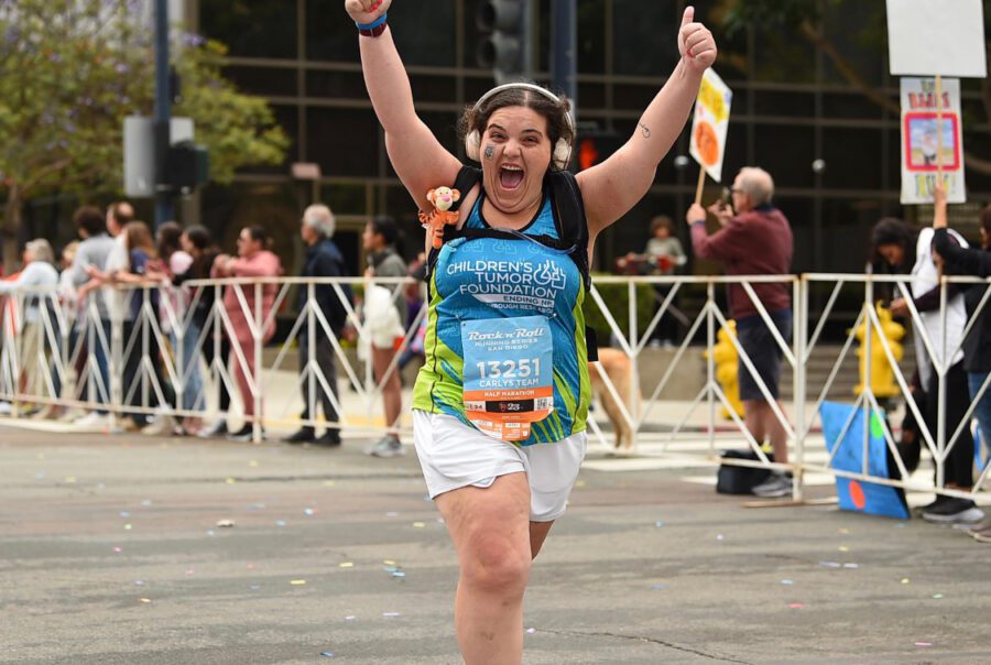 Woman Running a race with CTF Shirt