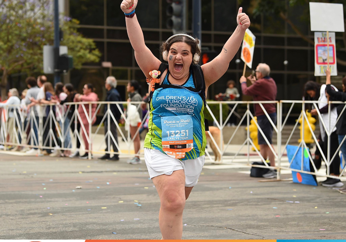 Woman Running a race with CTF Shirt