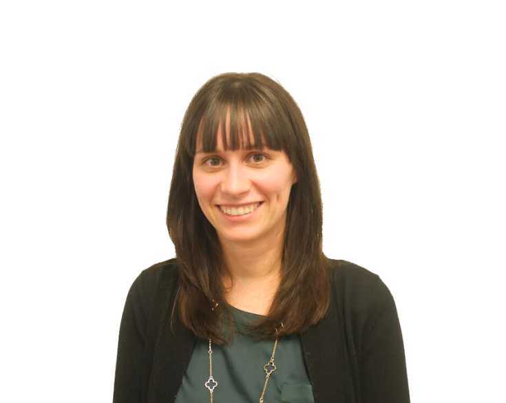 A woman wearing a black shirt and necklace.