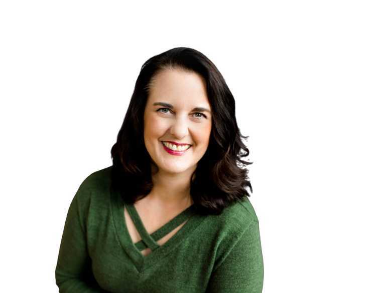 A smiling woman in a green sweater.