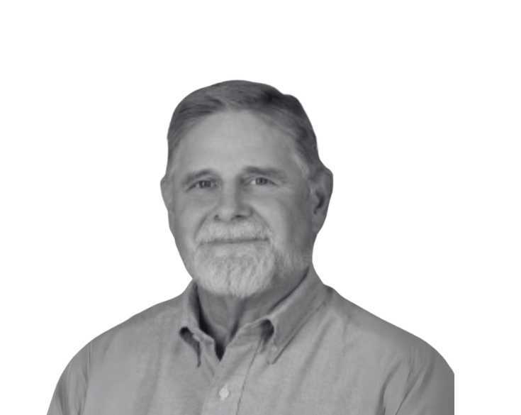 A black and white photo of a man with a beard.