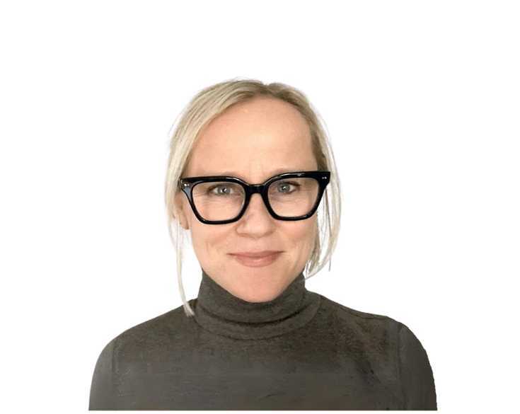 A woman wearing glasses and a turtle neck.