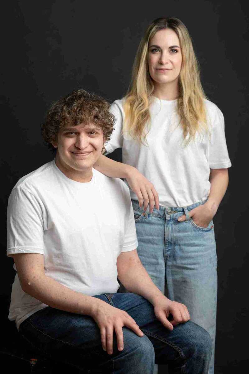 A young man and woman posing for a photo.