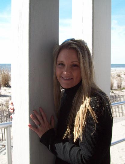 girl smiling leaning against wall