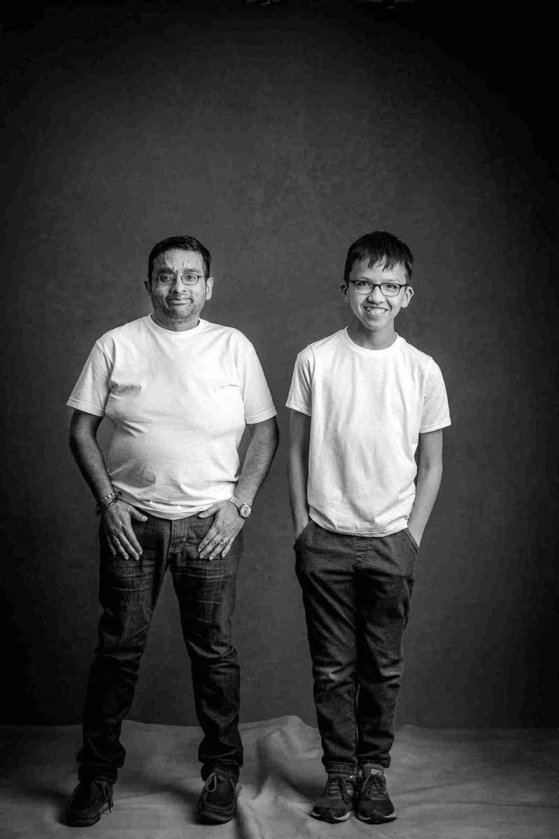 A black and white photo of two men posing for a photo.