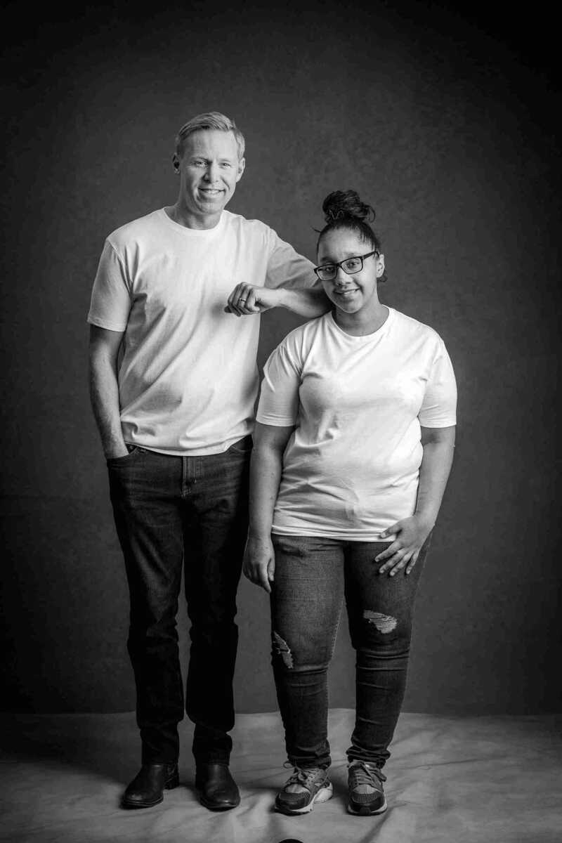 A man and woman posing for a black and white photo.