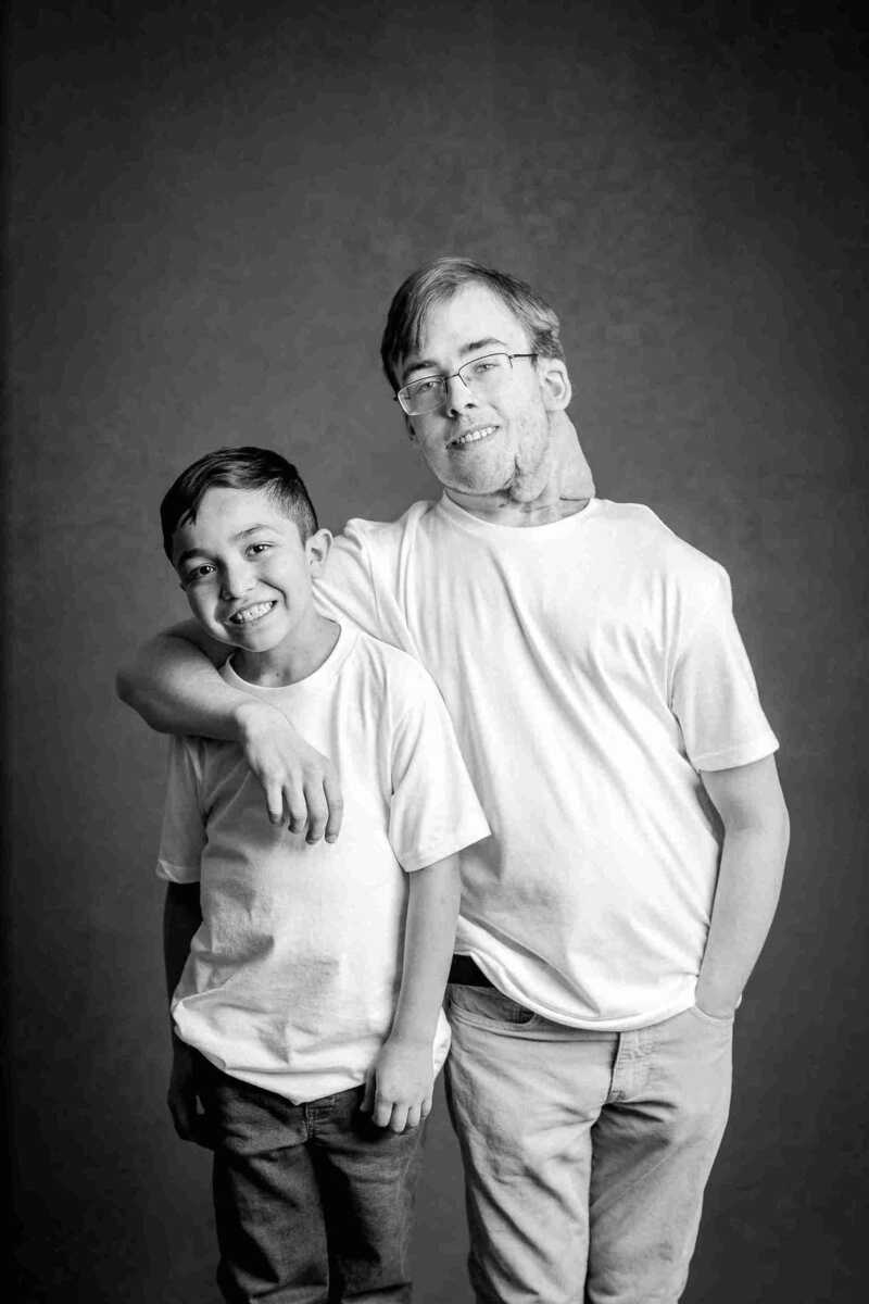 A black and white photo of a man and a boy.