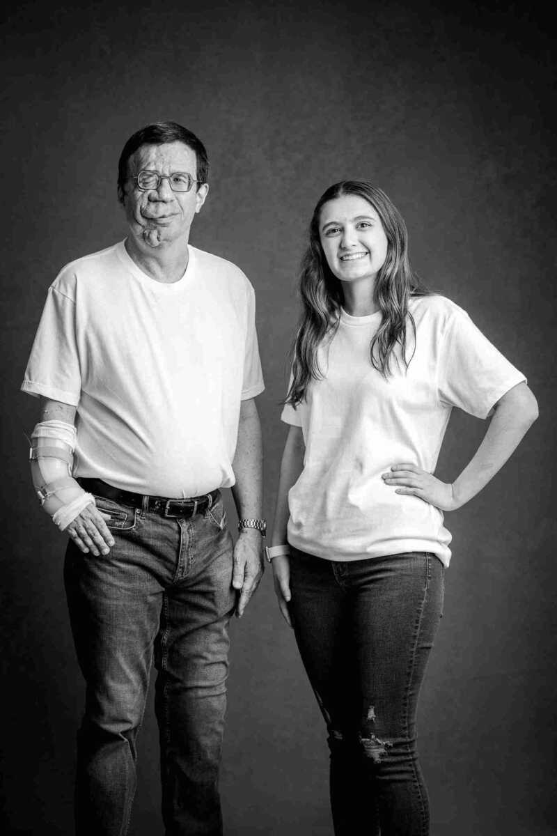 A man and woman posing for a black and white photo.