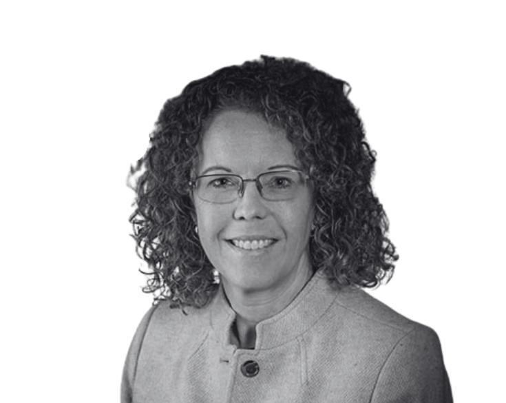 A black and white photo of a woman with curly hair.