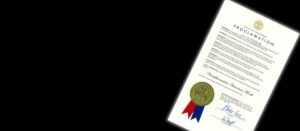 A certificate with a blue ribbon on it.