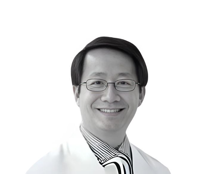 Lu Le, MD, PhD A man with glasses and short dark hair smiles while wearing a striped shirt, tie, and a white coat against a plain white background.