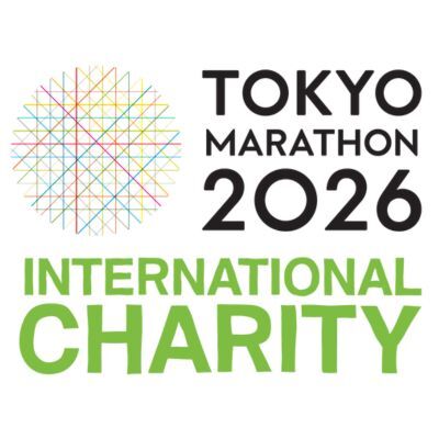 Logo for the Tokyo Marathon 2026 International Charity, featuring a multicolored geometric circle and bold black and green text.